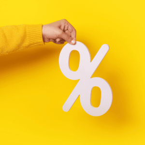 hand holding a percent symbol cut-out